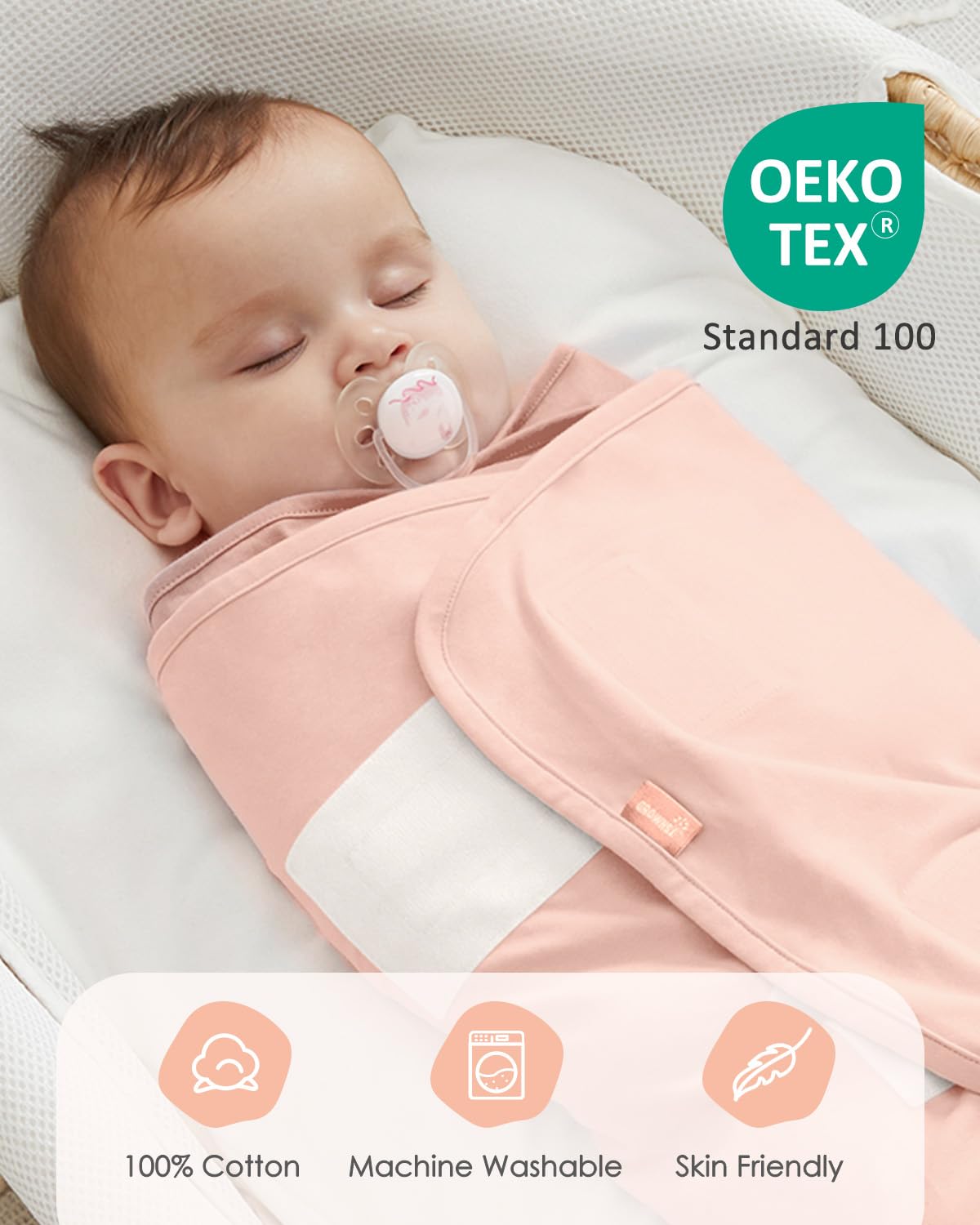 Baby sleeping in pink 100% cotton swaddle sack. Oeko-Tex certified, machine washable, skin-friendly for newborns 0-6 months.