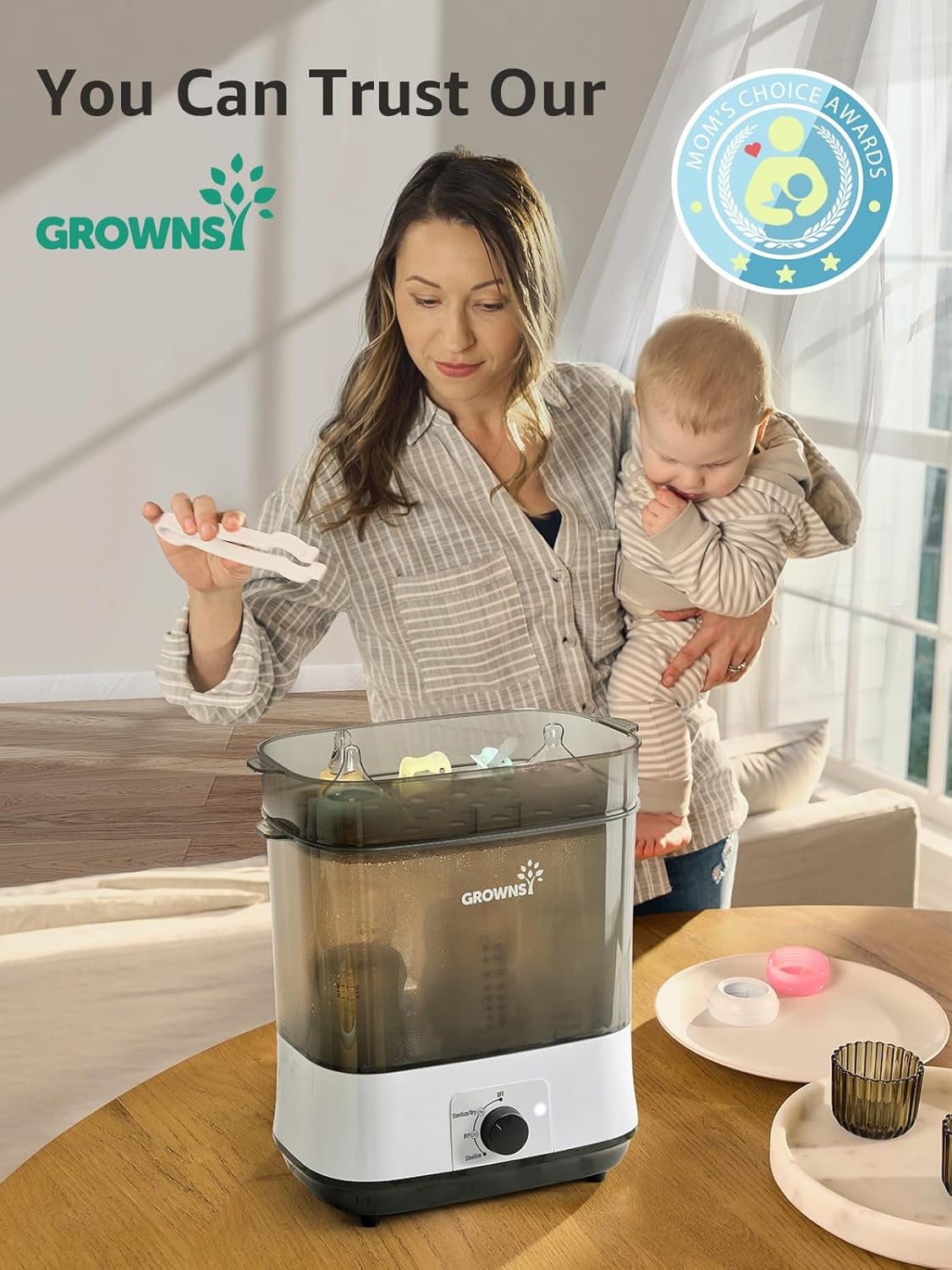 Mom using Grownsy PureMax sterilizer for baby bottles, awarded Mom's Choice.