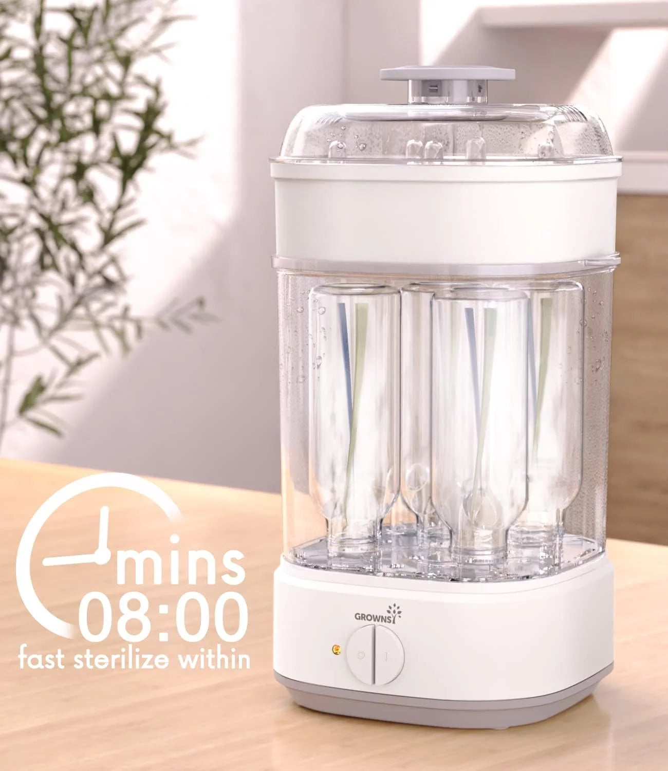 White and grey electric baby bottle sterilizer with baby bottles inside, 08:00 mins fast sterilize timer visible.