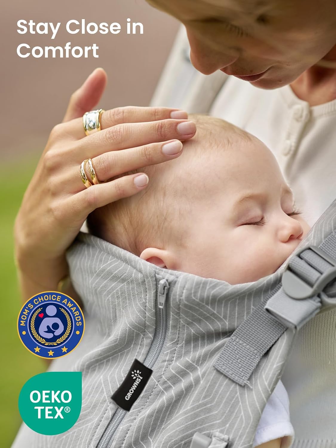 Gray striped ergonomic baby carrier with sleeping baby. Mom's Choice Awards and OEKO-TEX certified.