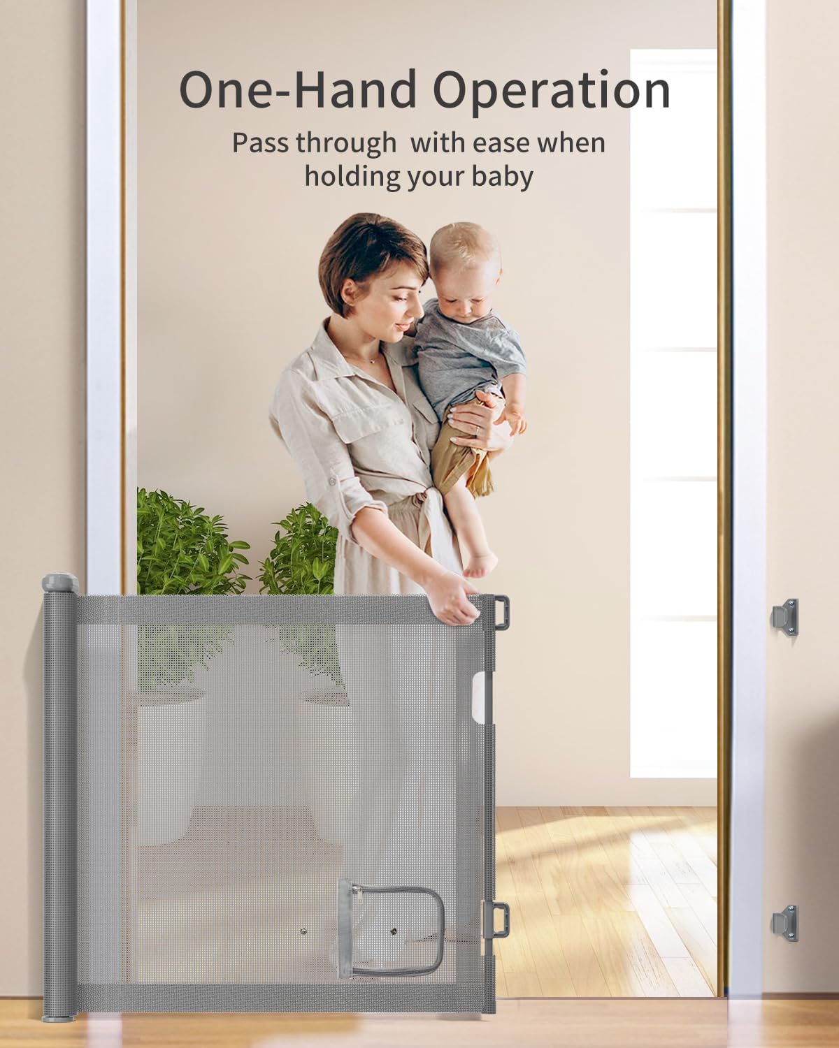 Woman holding baby reaching for GROWNSY gray retractable baby gate with pet door, demonstrating one-hand operation.