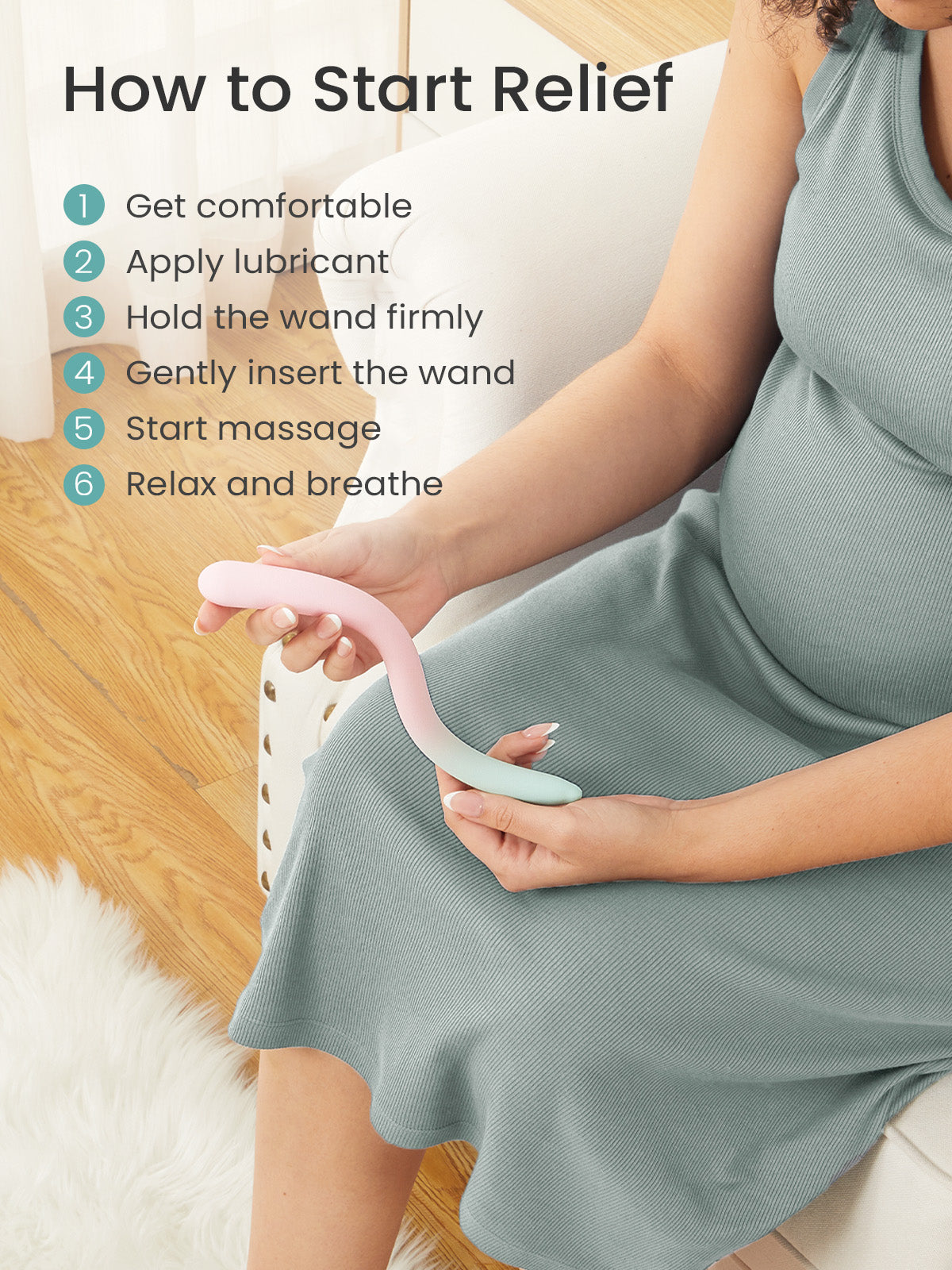 Pregnant person holding pink and light blue perineal massage wand, demonstrating prenatal care for labor preparation.