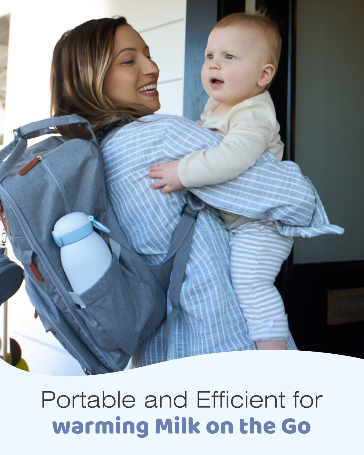White and blue portable baby bottle warmer in backpack side pocket, shown with mom and baby for on-the-go feeding.