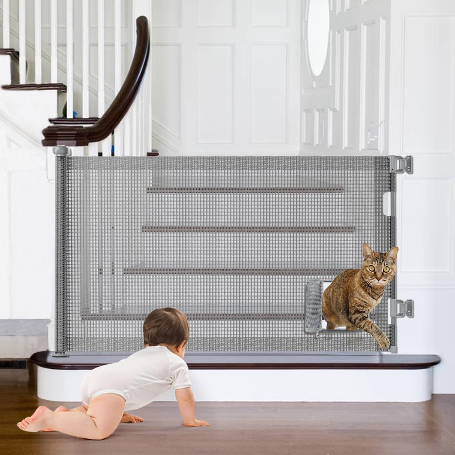 GROWNSY retractable baby gate with cat door installed at stairs, a baby crawls near it as a cat exits the cat door.