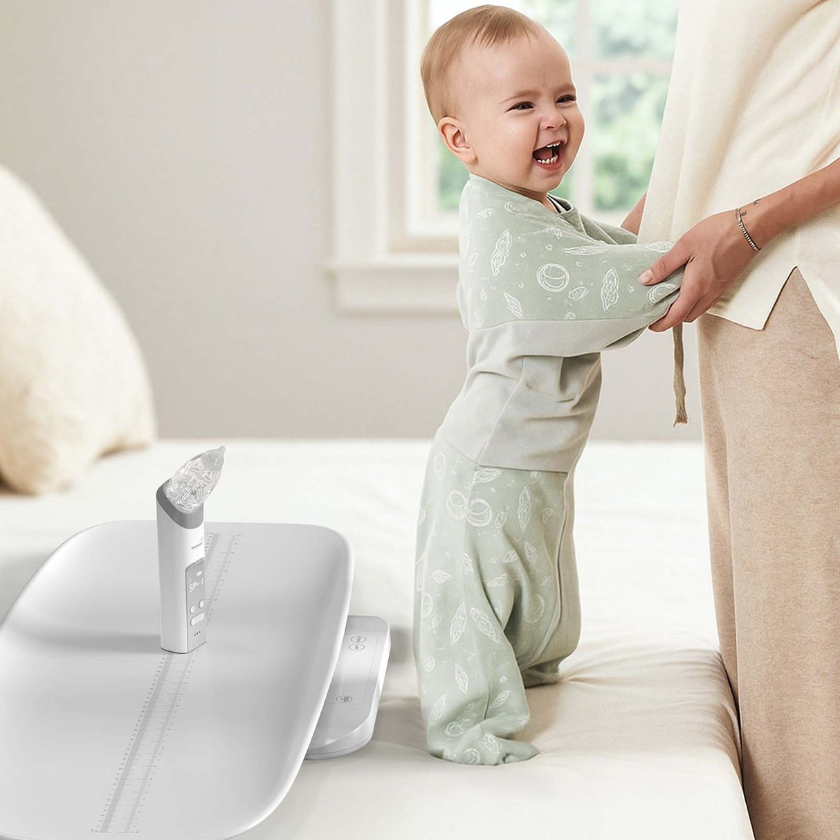 Newborn Wellness Care Set: Baby using scale with nasal aspirator nearby.