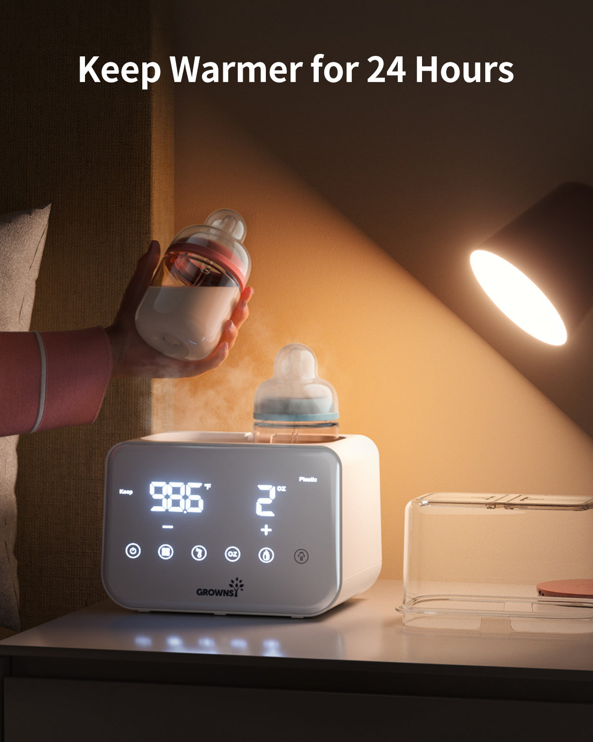 White baby bottle warmer keeps milk warm at 98.6°F for 24 hours. Steam warming a bottle.