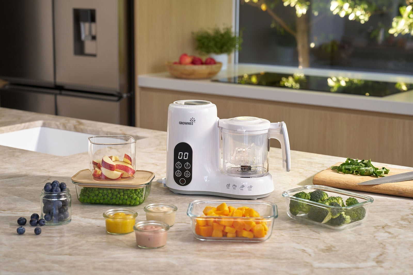 GROWNSY baby food maker on kitchen counter with fresh fruits, vegetables, and purees