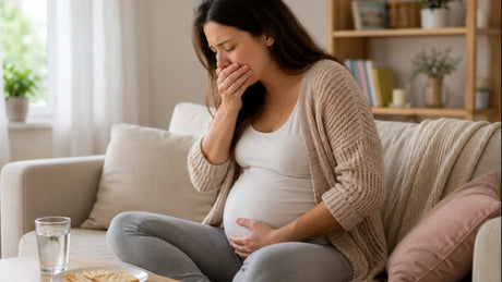 Pregnant woman experiencing nausea at home