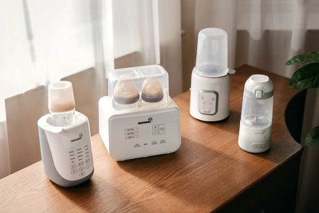 Grownsy Baby Bottle Warmers are displayed on the desk